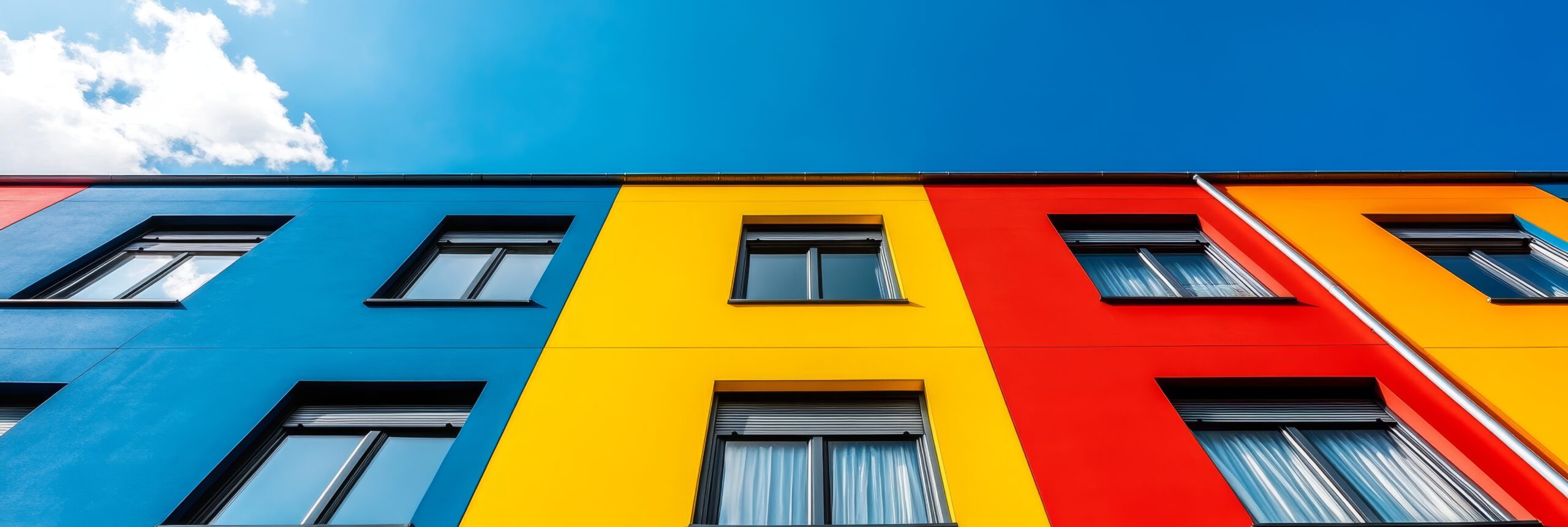 colorful modern building with bright blue yellow red exterior showcasing bold design